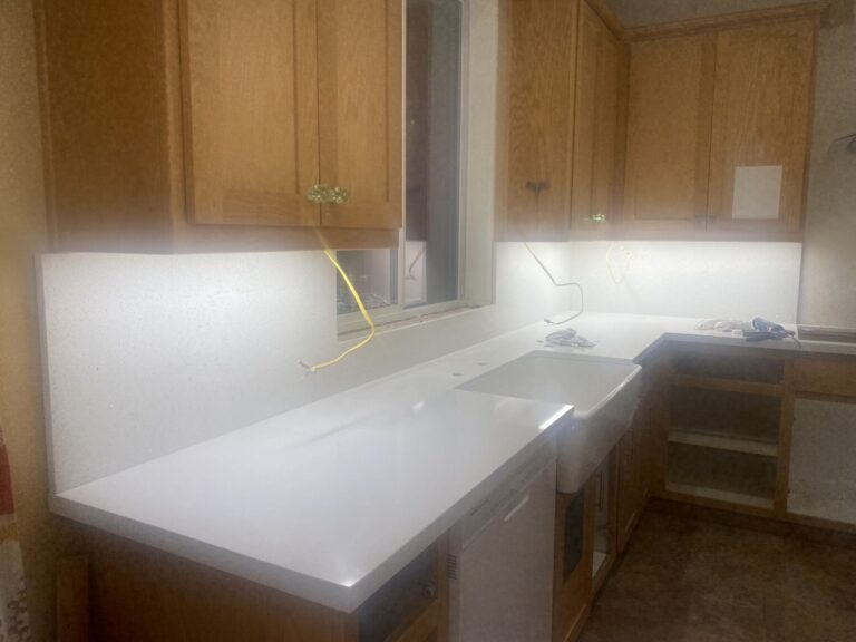 New Quartz Countertops and backsplash installed